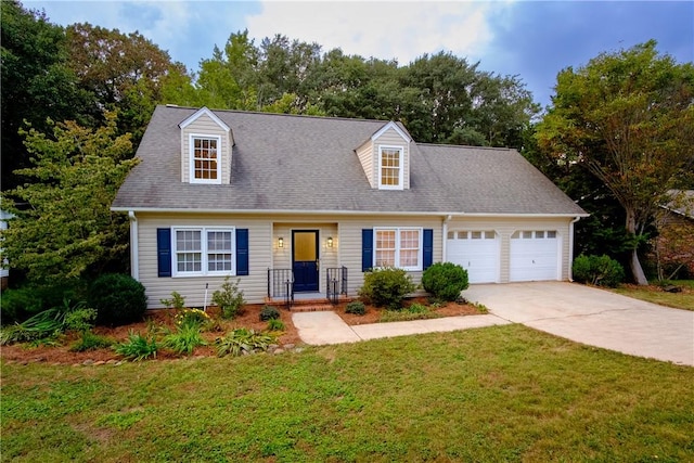 new england style home with a garage, a front yard, and concrete driveway