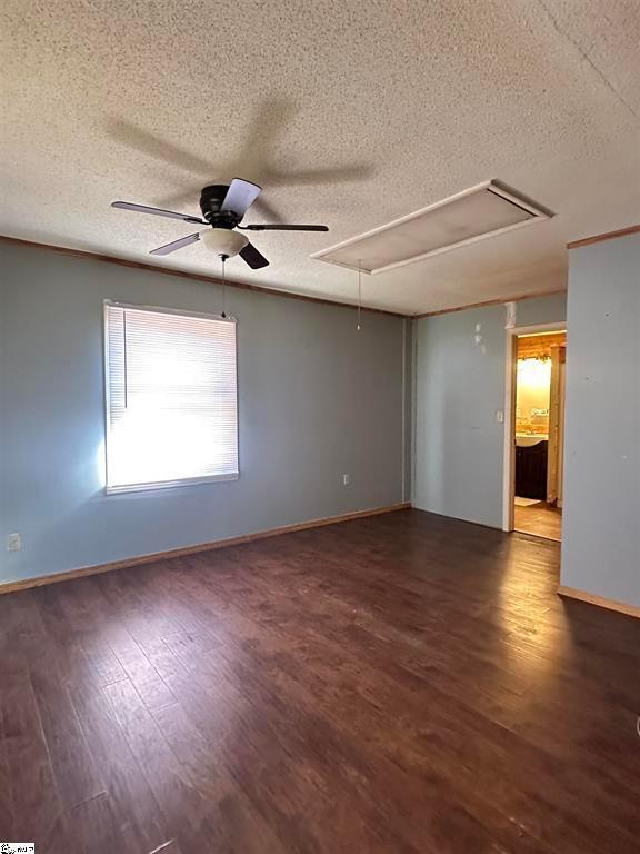 271 Piper Ln, Pickens, SC 29671 - empty room with attic access, a textured ceiling, wood finished floors, and a ceiling fan