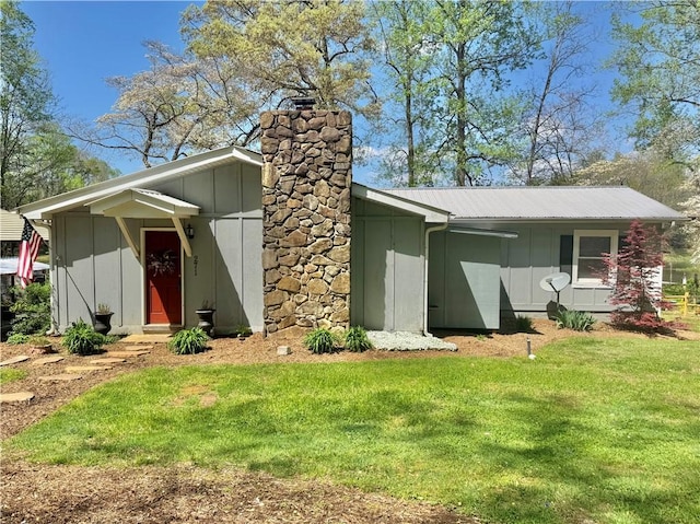 271 Piper Ln, Pickens, SC 29671 - back of house with a yard, board and batten siding, a chimney, and a metal roof