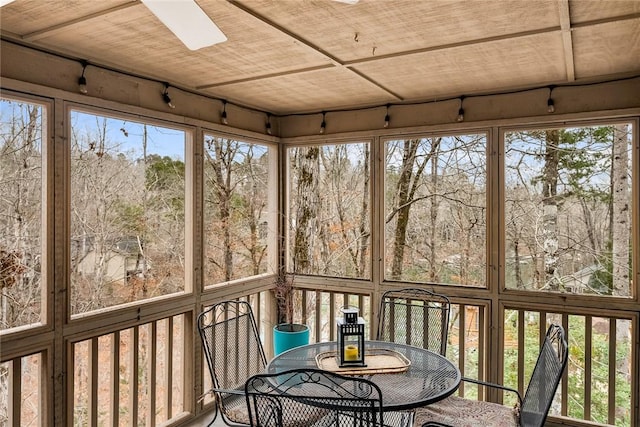 unfurnished sunroom with wood ceiling