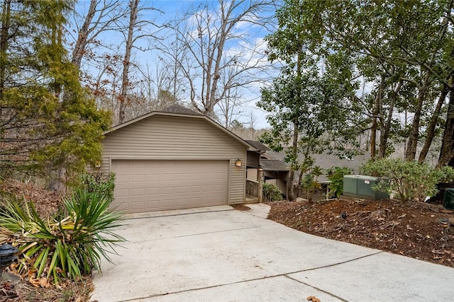 view of front of house featuring a garage and concrete driveway