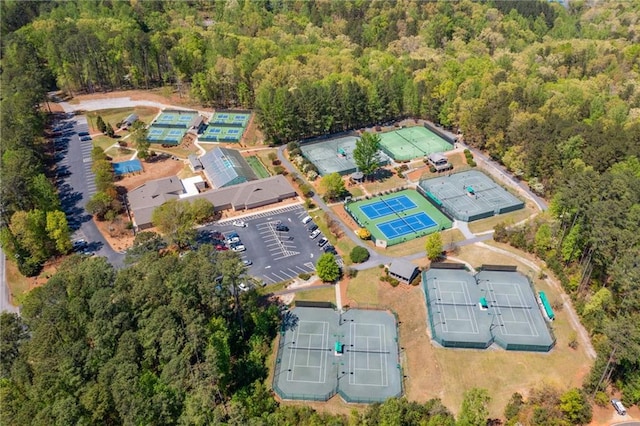 drone / aerial view featuring a forest view