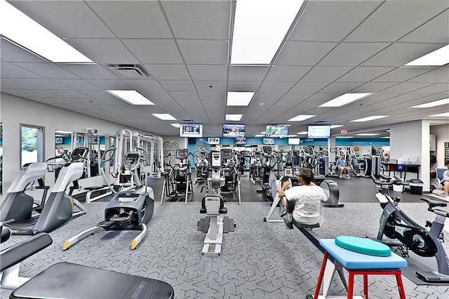 gym featuring a drop ceiling and visible vents