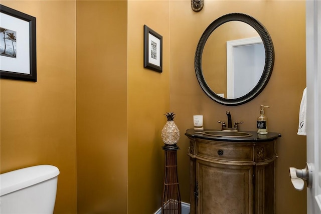 bathroom featuring vanity and toilet