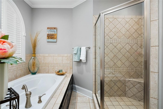 bathroom with crown molding, a shower stall, a bath, baseboards, and tile patterned floors