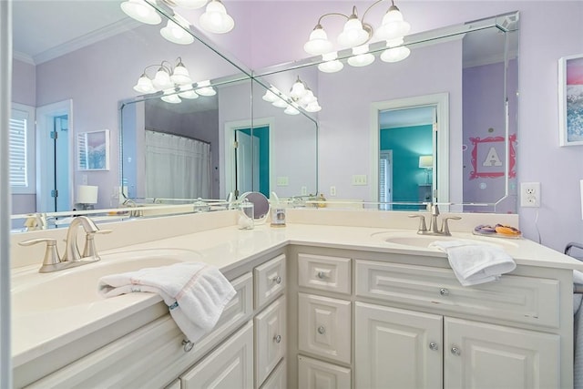 bathroom with double vanity, ornamental molding, a sink, and a notable chandelier