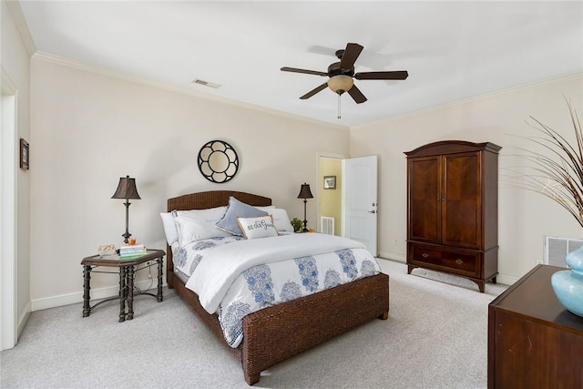 bedroom featuring ornamental molding, light carpet, visible vents, and baseboards