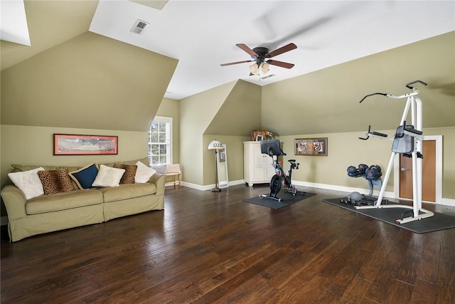 exercise area featuring wood finished floors, a ceiling fan, visible vents, vaulted ceiling, and baseboards