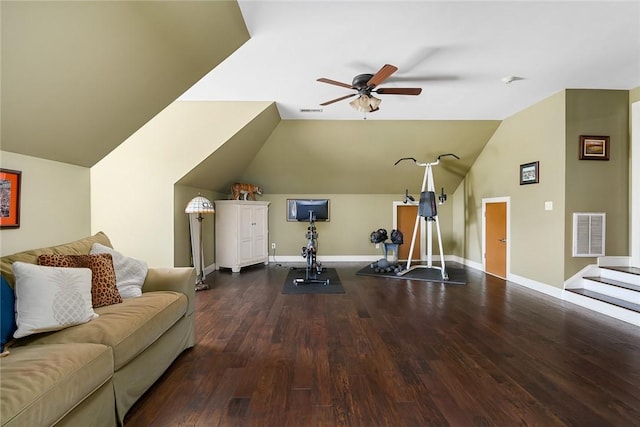 workout area with visible vents, vaulted ceiling, baseboards, and wood finished floors