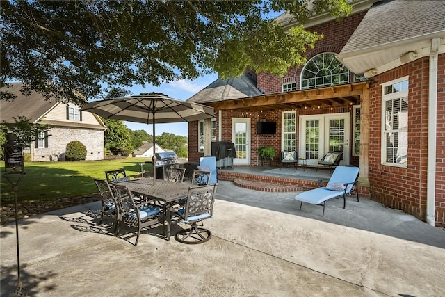 view of patio / terrace featuring outdoor dining space, french doors, and area for grilling