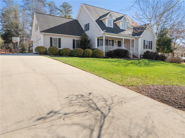 view of front facade with driveway, a garage, roof with shingles, covered porch, and a front lawn