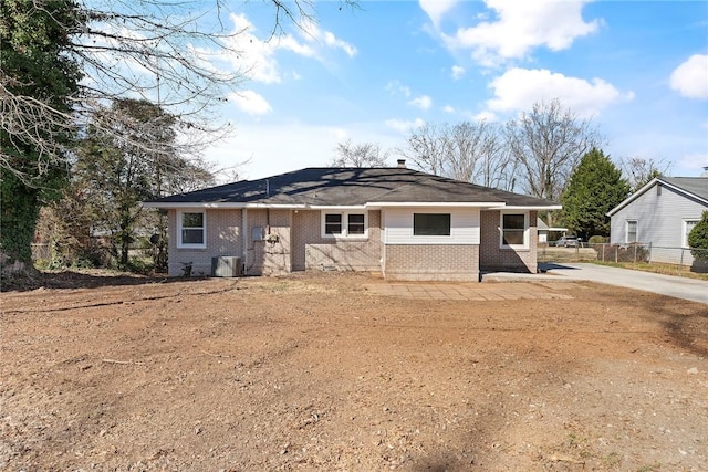 ranch-style house with brick siding and fence