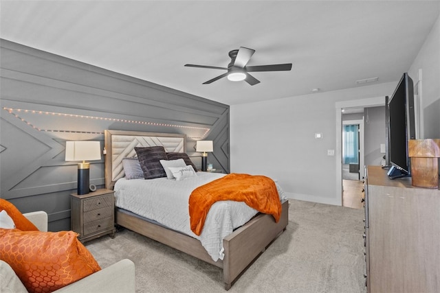 bedroom featuring visible vents, carpet flooring, baseboards, and ceiling fan