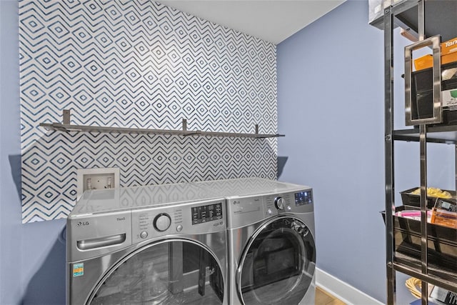 washroom with laundry area and washer and dryer