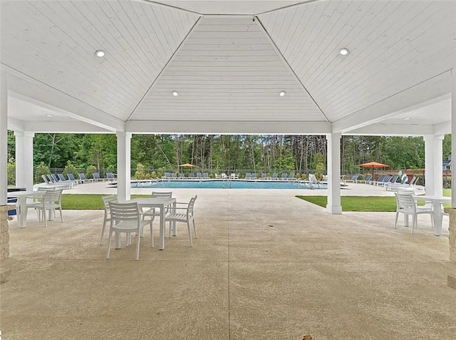 view of patio featuring a gazebo and a community pool