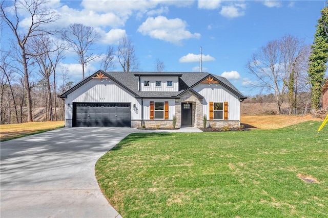 modern farmhouse featuring an attached garage, a shingled roof, stone siding, concrete driveway, and a front lawn