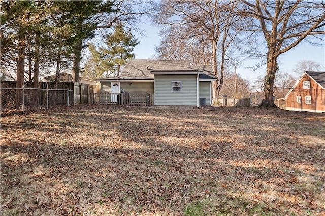 back of property featuring fence