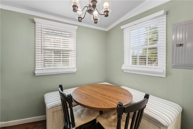 dining space featuring ornamental molding, electric panel, a notable chandelier, and baseboards