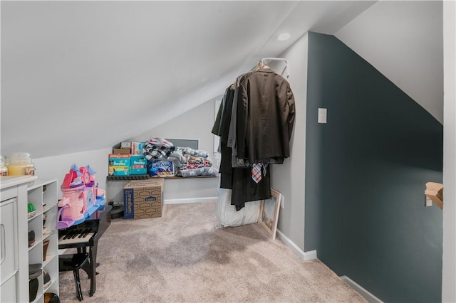 bonus room featuring lofted ceiling, carpet floors, and baseboards