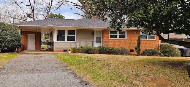 ranch-style house with aphalt driveway, crawl space, brick siding, and a front lawn