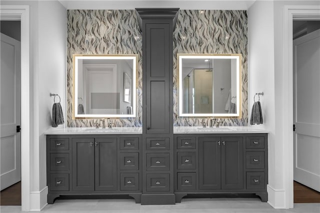 full bathroom featuring walk in shower, a sink, and double vanity