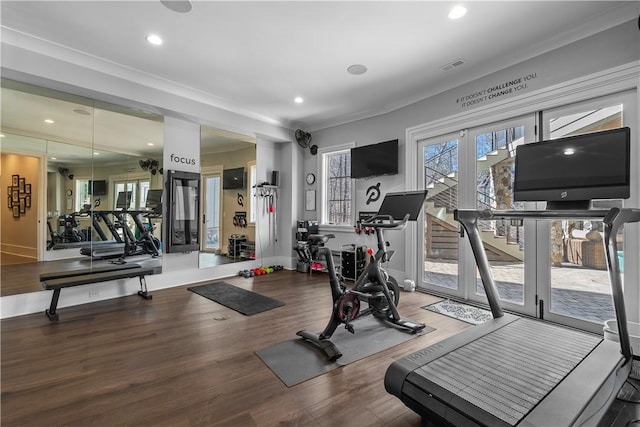 exercise room featuring recessed lighting, visible vents, baseboards, and wood finished floors