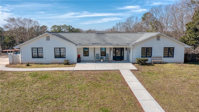 ranch-style house with fence, a front lawn, and stucco siding