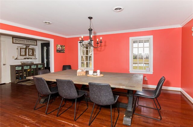 dining space with an inviting chandelier, dark wood finished floors, visible vents, and crown molding