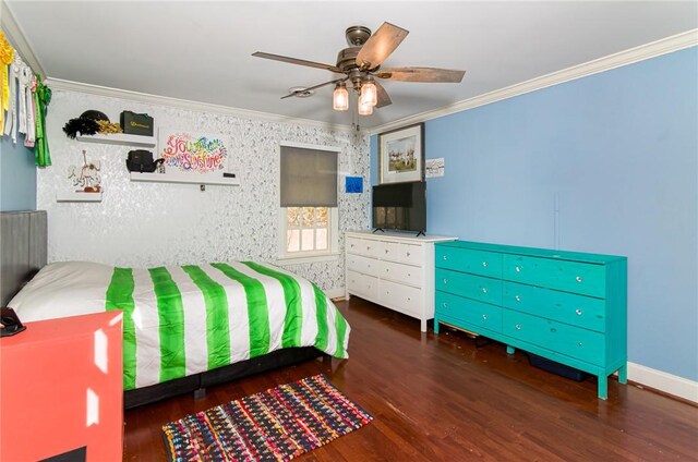 bedroom with baseboards, ceiling fan, wood finished floors, and crown molding