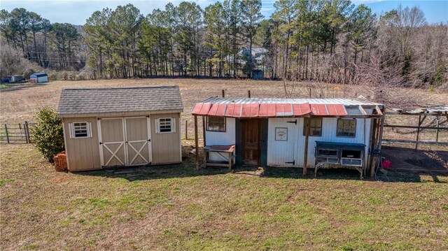 view of shed with fence