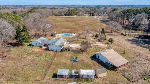 birds eye view of property with a rural view