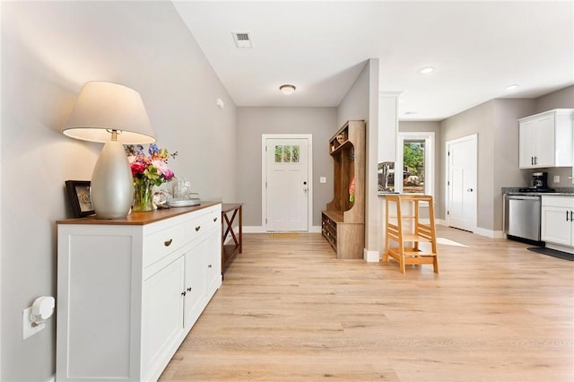 entrance foyer with light wood-style floors, recessed lighting, visible vents, and baseboards