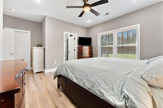 bedroom featuring recessed lighting, a ceiling fan, visible vents, baseboards, and light wood finished floors