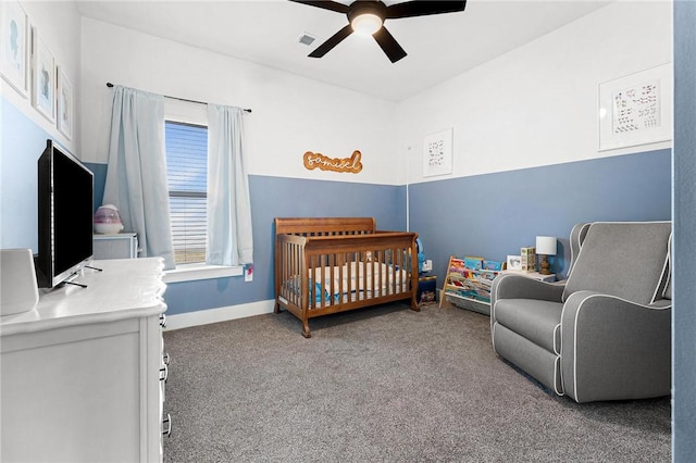 carpeted bedroom with a nursery area, a ceiling fan, visible vents, and baseboards