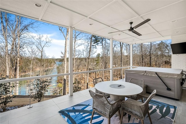 sunroom / solarium with a ceiling fan