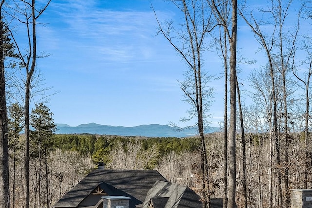 view of mountain feature with a view of trees