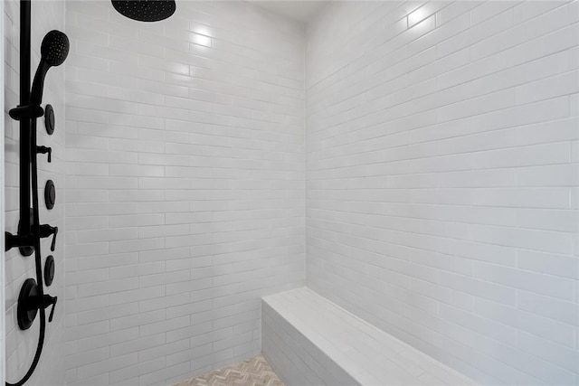 full bathroom with a tile shower