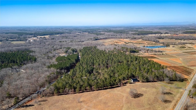 aerial view featuring a rural view and a view of trees