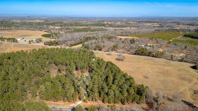 birds eye view of property with a rural view