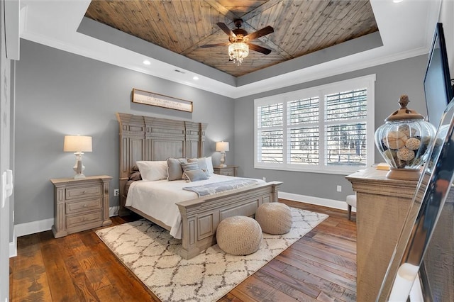 bedroom with a tray ceiling, wood ceiling, and baseboards