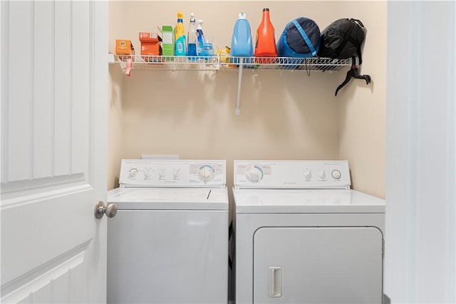 washroom with laundry area and separate washer and dryer