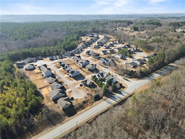 aerial view with a residential view and a wooded view