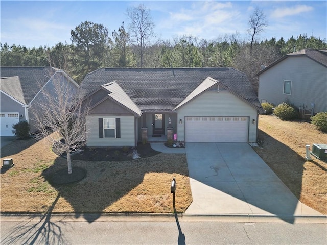 single story home with a garage, concrete driveway, and a shingled roof