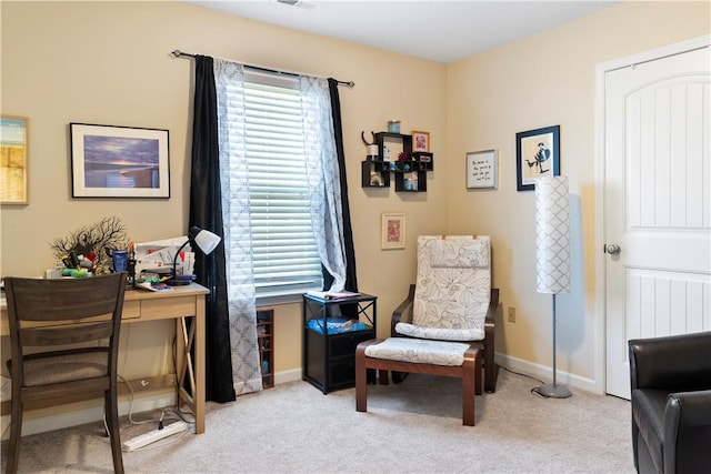 carpeted office space with a healthy amount of sunlight, visible vents, and baseboards