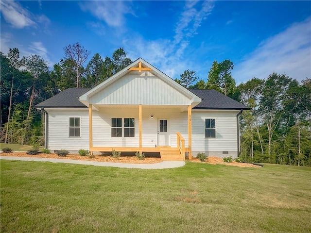 view of front of property featuring a front yard, crawl space, roof with shingles, and covered porch