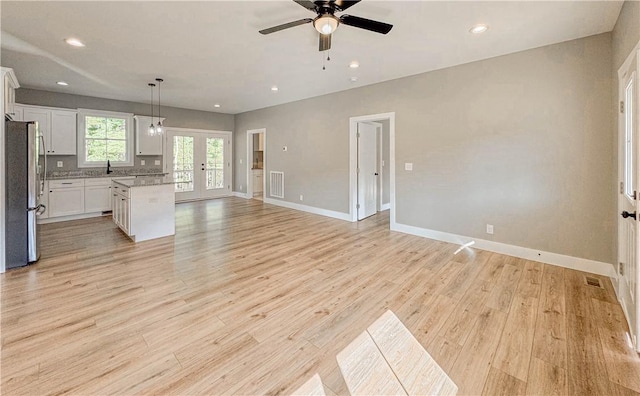 224 Simpson St, Westminster, SC 29693 - unfurnished living room featuring a ceiling fan, french doors, light wood-style flooring, and recessed lighting