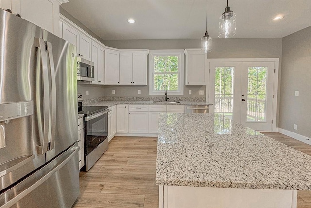224 Simpson St, Westminster, SC 29693 - kitchen featuring stainless steel appliances, white cabinetry, light wood-type flooring, french doors, and recessed lighting