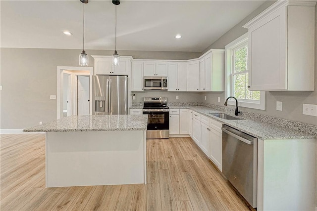 224 Simpson St, Westminster, SC 29693 - kitchen with stainless steel appliances, light wood-style flooring, white cabinetry, and recessed lighting