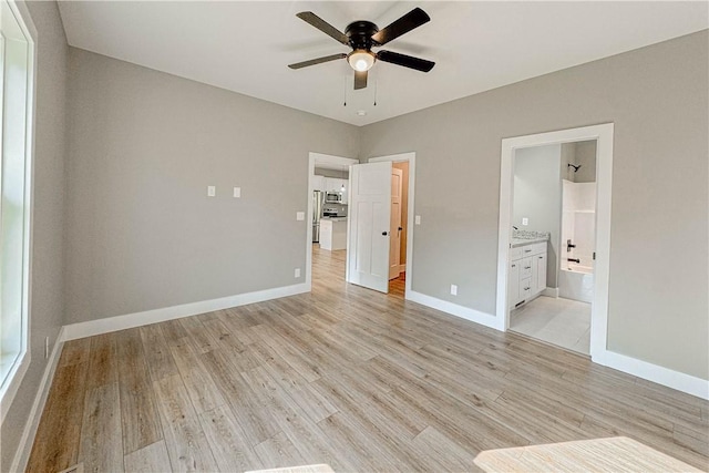 224 Simpson St, Westminster, SC 29693 - unfurnished bedroom with light wood finished floors, ensuite bath, and a ceiling fan