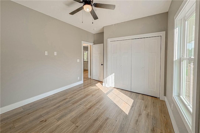 224 Simpson St, Westminster, SC 29693 - unfurnished bedroom with light wood finished floors, multiple windows, and a closet